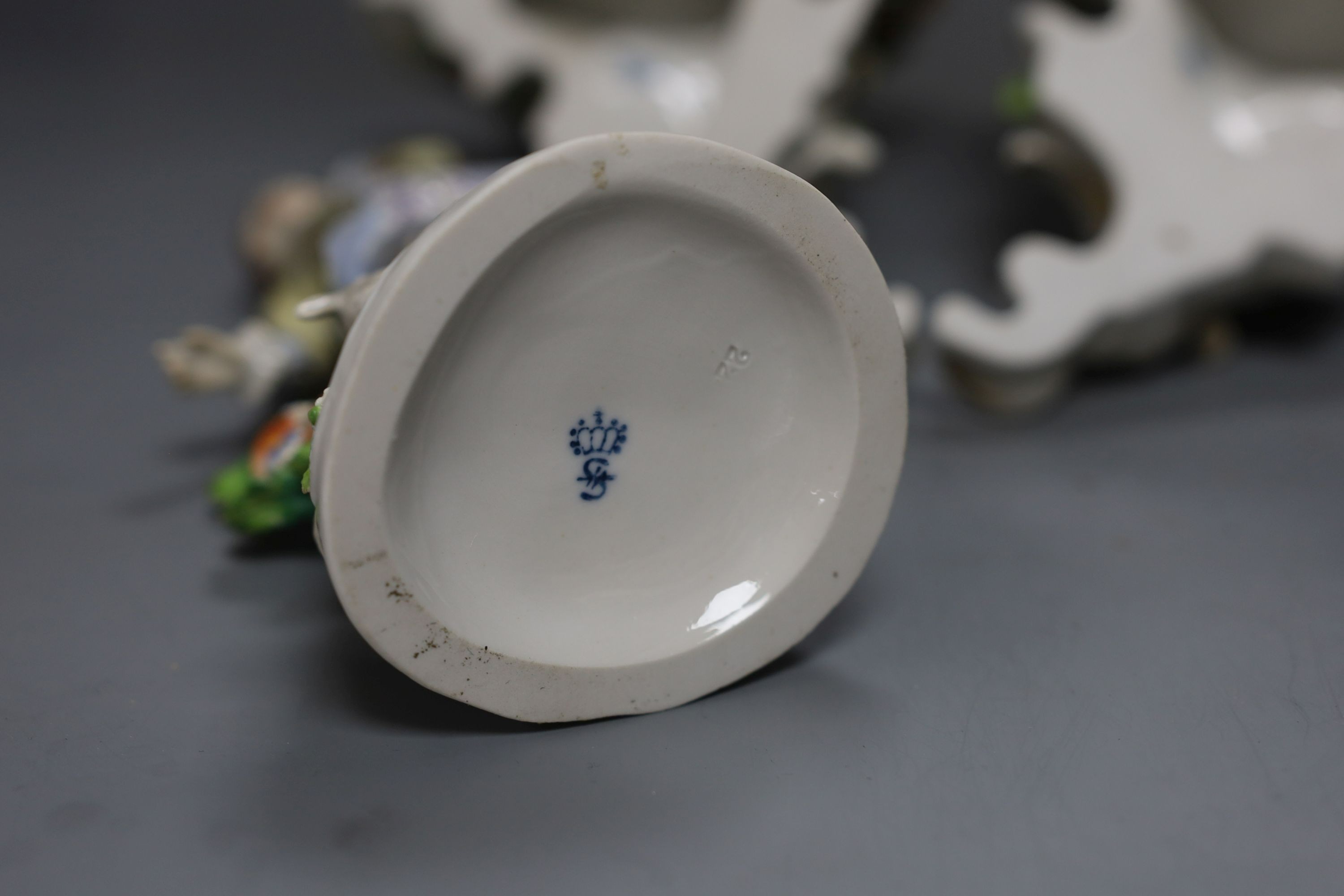 A pair of Sitzendorf wall brackets, 16cm tall, together with a Sitzendorf figure (3)